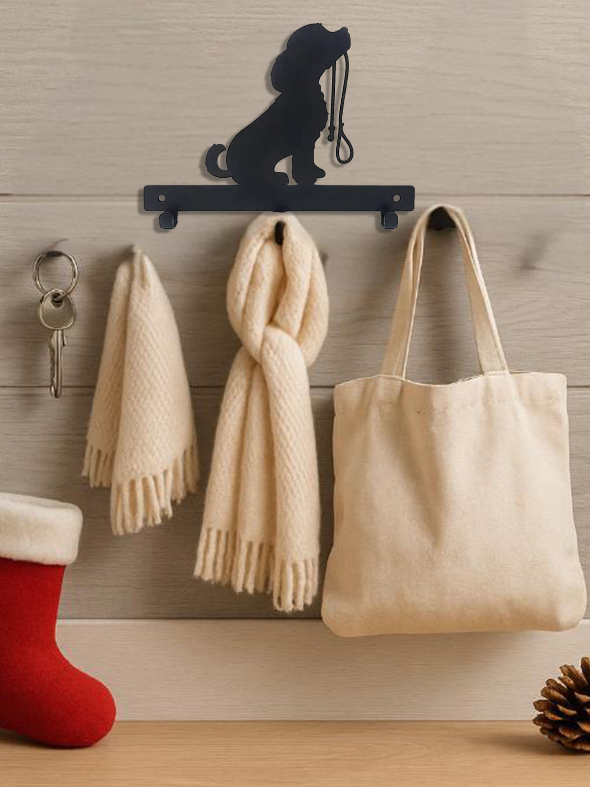 Sitting dog silhouette wall hook rack holding a scarf and tote bag